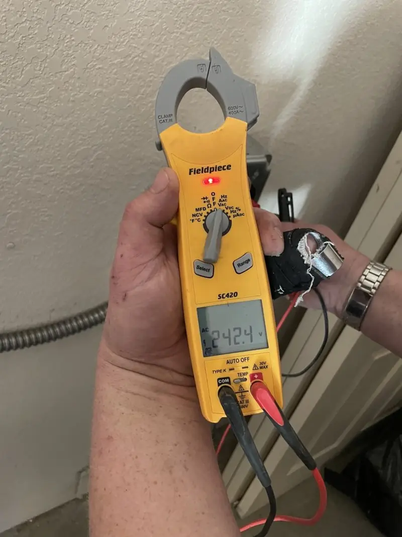 Voltage testing with clamp meter during Ceiling Fan Installation in East Lampeter